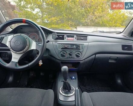 Черный Мицубиси Лансер, объемом двигателя 2 л и пробегом 225 тыс. км за 4400 $, фото 13 на Automoto.ua