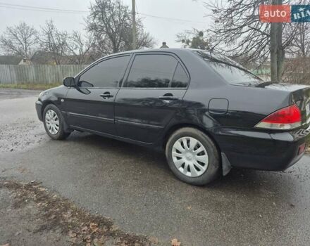 Черный Мицубиси Лансер, объемом двигателя 1.58 л и пробегом 280 тыс. км за 3200 $, фото 2 на Automoto.ua