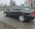 Черный Мицубиси Лансер, объемом двигателя 1.58 л и пробегом 280 тыс. км за 3200 $, фото 2 на Automoto.ua