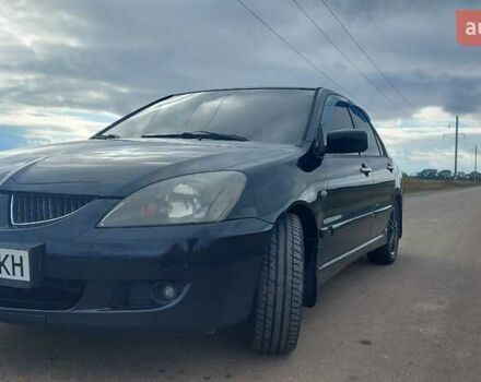 Черный Мицубиси Лансер, объемом двигателя 2 л и пробегом 225 тыс. км за 4400 $, фото 2 на Automoto.ua