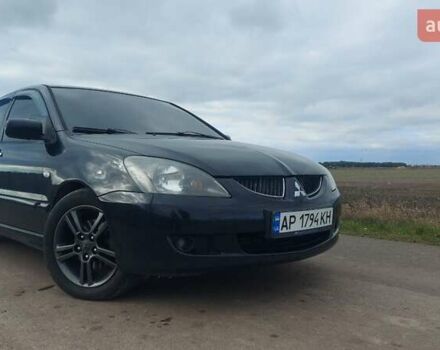 Черный Мицубиси Лансер, объемом двигателя 2 л и пробегом 225 тыс. км за 4400 $, фото 3 на Automoto.ua