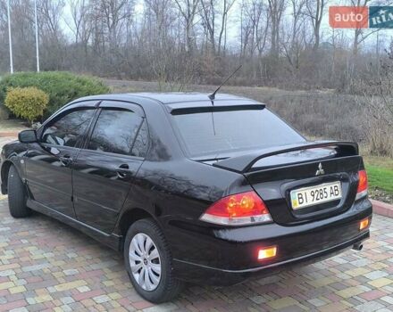 Чорний Міцубісі Lancer, об'ємом двигуна 1.58 л та пробігом 263 тис. км за 4500 $, фото 16 на Automoto.ua