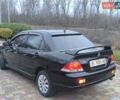 Чорний Міцубісі Lancer, об'ємом двигуна 1.58 л та пробігом 263 тис. км за 4500 $, фото 16 на Automoto.ua