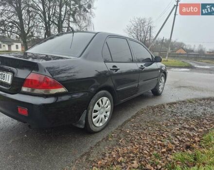 Черный Мицубиси Лансер, объемом двигателя 1.58 л и пробегом 280 тыс. км за 3200 $, фото 4 на Automoto.ua