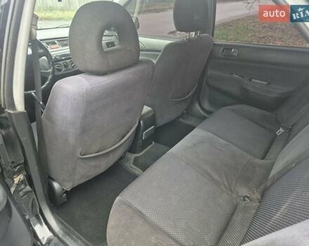 Черный Мицубиси Лансер, объемом двигателя 1.58 л и пробегом 280 тыс. км за 3200 $, фото 12 на Automoto.ua