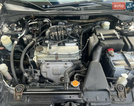 Чорний Міцубісі Lancer, об'ємом двигуна 1.58 л та пробігом 364 тис. км за 4000 $, фото 14 на Automoto.ua