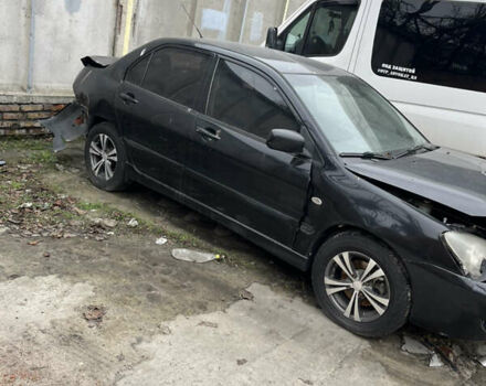 Черный Мицубиси Лансер, объемом двигателя 1.58 л и пробегом 360 тыс. км за 1500 $, фото 1 на Automoto.ua