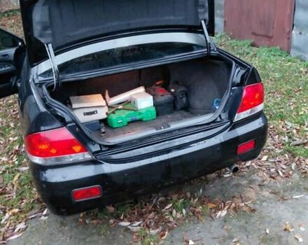 Черный Мицубиси Лансер, объемом двигателя 1.58 л и пробегом 238 тыс. км за 3500 $, фото 4 на Automoto.ua