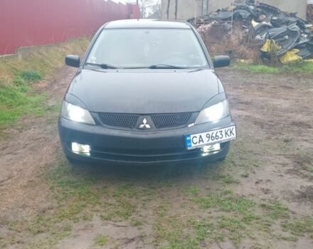 Черный Мицубиси Лансер, объемом двигателя 2 л и пробегом 270 тыс. км за 3200 $, фото 2 на Automoto.ua
