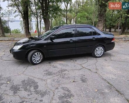 Черный Мицубиси Лансер, объемом двигателя 1.58 л и пробегом 352 тыс. км за 4000 $, фото 4 на Automoto.ua