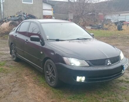Черный Мицубиси Лансер, объемом двигателя 2 л и пробегом 270 тыс. км за 3200 $, фото 3 на Automoto.ua
