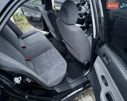 Черный Мицубиси Лансер, объемом двигателя 1.58 л и пробегом 154 тыс. км за 5500 $, фото 33 на Automoto.ua