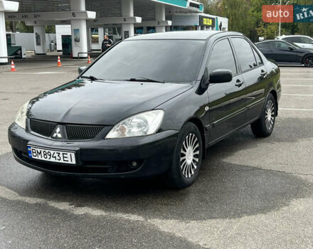 Черный Мицубиси Лансер, объемом двигателя 1.58 л и пробегом 300 тыс. км за 3850 $, фото 3 на Automoto.ua