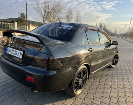 Чорний Міцубісі Lancer, об'ємом двигуна 2 л та пробігом 261 тис. км за 2700 $, фото 11 на Automoto.ua