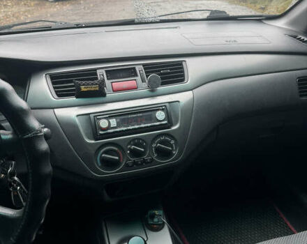 Черный Мицубиси Лансер, объемом двигателя 1.58 л и пробегом 264 тыс. км за 4600 $, фото 2 на Automoto.ua