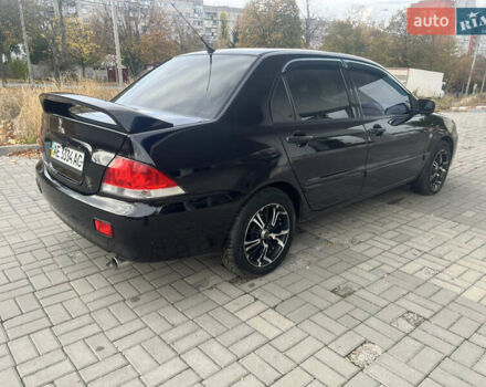 Чорний Міцубісі Lancer, об'ємом двигуна 1.58 л та пробігом 364 тис. км за 4000 $, фото 7 на Automoto.ua
