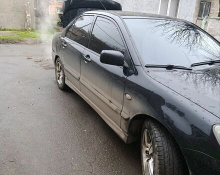 Черный Мицубиси Лансер, объемом двигателя 2 л и пробегом 275 тыс. км за 2599 $, фото 1 на Automoto.ua