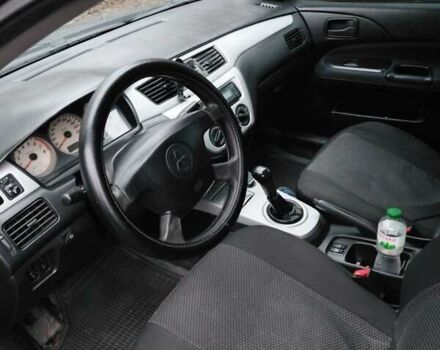 Черный Мицубиси Лансер, объемом двигателя 1.58 л и пробегом 238 тыс. км за 3500 $, фото 5 на Automoto.ua