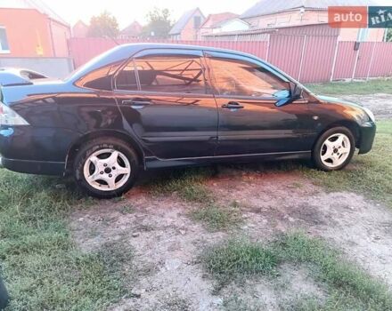 Чорний Міцубісі Lancer, об'ємом двигуна 1.58 л та пробігом 294 тис. км за 3800 $, фото 7 на Automoto.ua