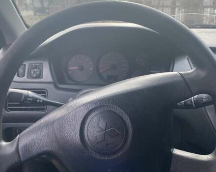 Чорний Міцубісі Lancer, об'ємом двигуна 1.58 л та пробігом 279 тис. км за 4000 $, фото 6 на Automoto.ua
