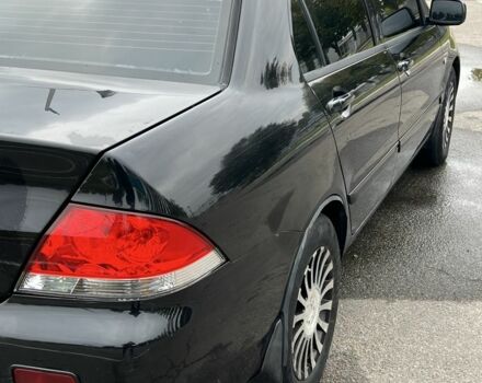 Черный Мицубиси Лансер, объемом двигателя 1.6 л и пробегом 390 тыс. км за 4000 $, фото 5 на Automoto.ua