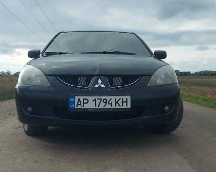 Черный Мицубиси Лансер, объемом двигателя 2 л и пробегом 225 тыс. км за 4400 $, фото 7 на Automoto.ua