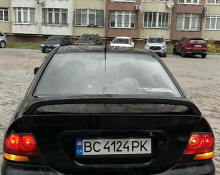 Черный Мицубиси Лансер, объемом двигателя 1.6 л и пробегом 200 тыс. км за 3000 $, фото 4 на Automoto.ua