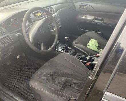 Чорний Міцубісі Lancer, об'ємом двигуна 1.58 л та пробігом 279 тис. км за 4000 $, фото 4 на Automoto.ua