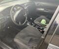 Чорний Міцубісі Lancer, об'ємом двигуна 1.58 л та пробігом 279 тис. км за 4000 $, фото 4 на Automoto.ua
