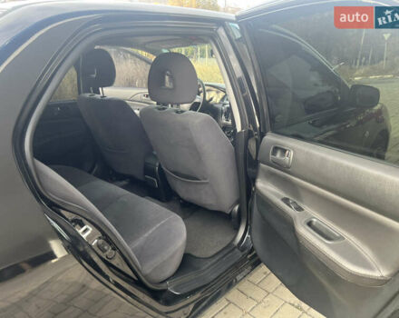 Чорний Міцубісі Lancer, об'ємом двигуна 1.58 л та пробігом 364 тис. км за 4000 $, фото 11 на Automoto.ua