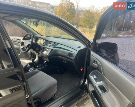 Чорний Міцубісі Lancer, об'ємом двигуна 1.58 л та пробігом 364 тис. км за 4000 $, фото 12 на Automoto.ua