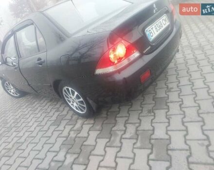 Чорний Міцубісі Lancer, об'ємом двигуна 1.58 л та пробігом 275 тис. км за 3100 $, фото 5 на Automoto.ua