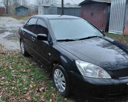 Черный Мицубиси Лансер, объемом двигателя 1.58 л и пробегом 238 тыс. км за 3500 $, фото 6 на Automoto.ua