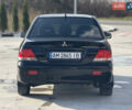 Чорний Міцубісі Lancer, об'ємом двигуна 1.6 л та пробігом 205 тис. км за 3650 $, фото 2 на Automoto.ua