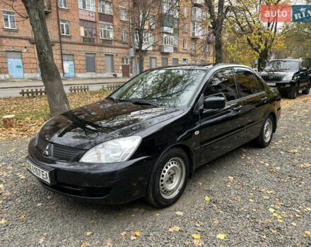 Черный Мицубиси Лансер, объемом двигателя 1.58 л и пробегом 341 тыс. км за 3950 $, фото 7 на Automoto.ua