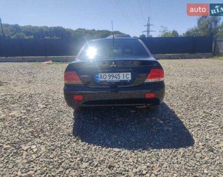 Чорний Міцубісі Lancer, об'ємом двигуна 1.58 л та пробігом 206 тис. км за 3600 $, фото 3 на Automoto.ua