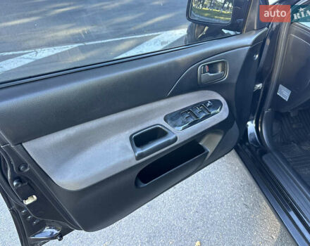 Мицубиси Лансер 2005 в Виннице на Automoto.ua Черный Мицубиси Лансер, объемом двигателя 1.6 л и пробегом 261 тыс. км за 4100 $, фото 32 на Automoto.ua