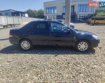 Чорний Міцубісі Lancer, об'ємом двигуна 1.58 л та пробігом 206 тис. км за 3600 $, фото 1 на Automoto.ua
