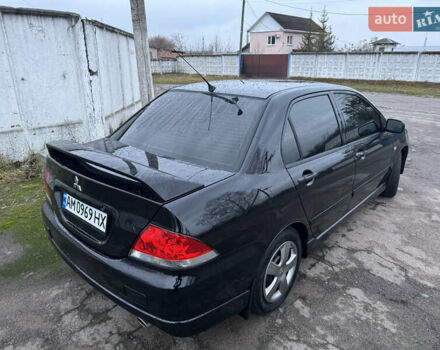 Черный Мицубиси Лансер, объемом двигателя 1.58 л и пробегом 154 тыс. км за 5500 $, фото 9 на Automoto.ua