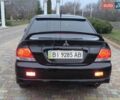 Чорний Міцубісі Lancer, об'ємом двигуна 1.58 л та пробігом 263 тис. км за 4500 $, фото 14 на Automoto.ua