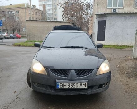 Черный Мицубиси Лансер, объемом двигателя 2 л и пробегом 275 тыс. км за 2599 $, фото 3 на Automoto.ua