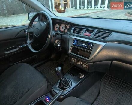 Чорний Міцубісі Lancer, об'ємом двигуна 1.58 л та пробігом 263 тис. км за 4500 $, фото 7 на Automoto.ua