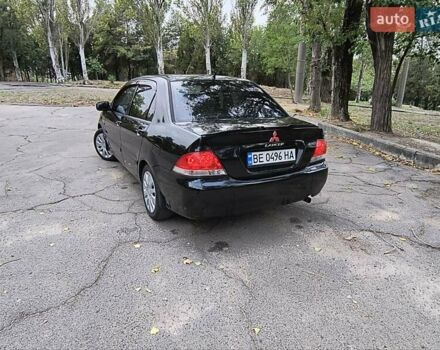 Черный Мицубиси Лансер, объемом двигателя 1.58 л и пробегом 352 тыс. км за 4000 $, фото 6 на Automoto.ua