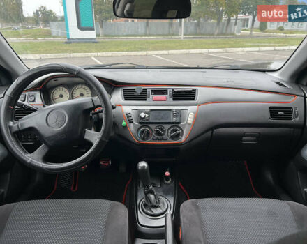 Черный Мицубиси Лансер, объемом двигателя 1.58 л и пробегом 300 тыс. км за 3850 $, фото 12 на Automoto.ua