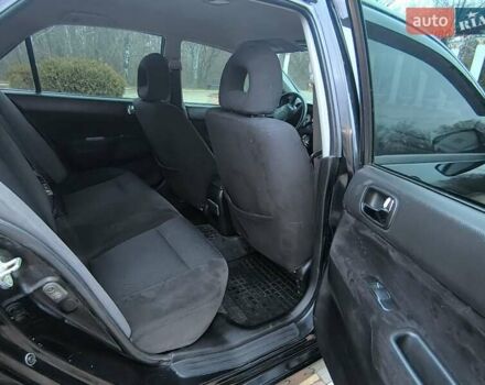 Чорний Міцубісі Lancer, об'ємом двигуна 1.58 л та пробігом 263 тис. км за 4500 $, фото 12 на Automoto.ua