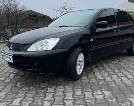 Черный Мицубиси Лансер, объемом двигателя 1.6 л и пробегом 240 тыс. км за 3499 $, фото 2 на Automoto.ua