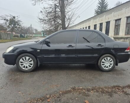 Черный Мицубиси Лансер, объемом двигателя 1.6 л и пробегом 280 тыс. км за 3200 $, фото 1 на Automoto.ua