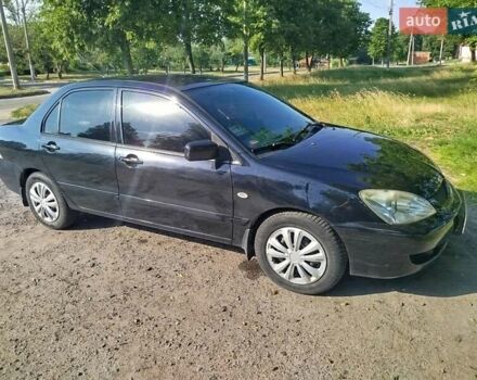 Чорний Міцубісі Lancer, об'ємом двигуна 1.6 л та пробігом 276 тис. км за 4000 $, фото 5 на Automoto.ua