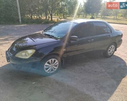 Чорний Міцубісі Lancer, об'ємом двигуна 1.6 л та пробігом 276 тис. км за 4000 $, фото 2 на Automoto.ua