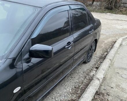 Чорний Міцубісі Lancer, об'ємом двигуна 1.6 л та пробігом 250 тис. км за 3500 $, фото 6 на Automoto.ua